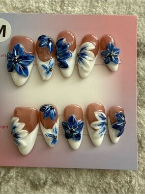 Handcrafted Blue Floral Press-On Nails with Nude Base Medium